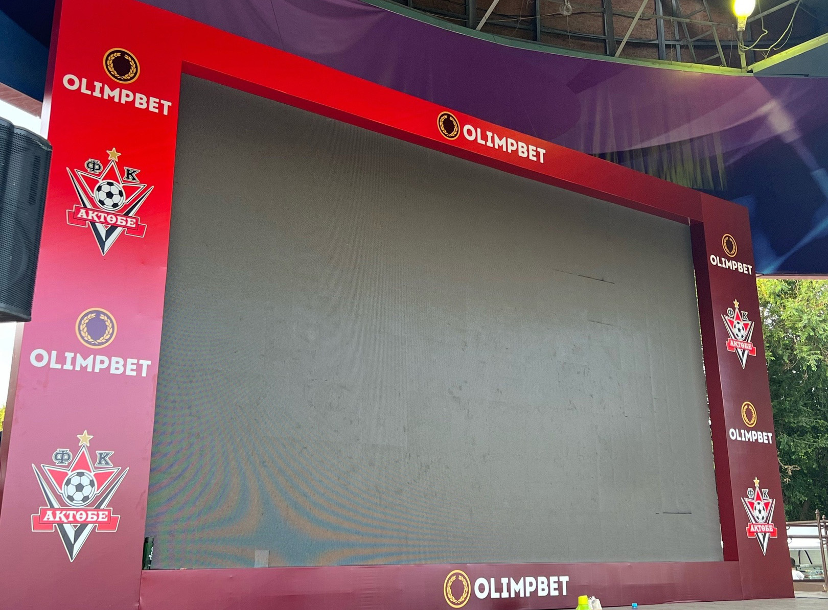 Match between Aktobe – Maqtaaral is on the big screen in Central Park
